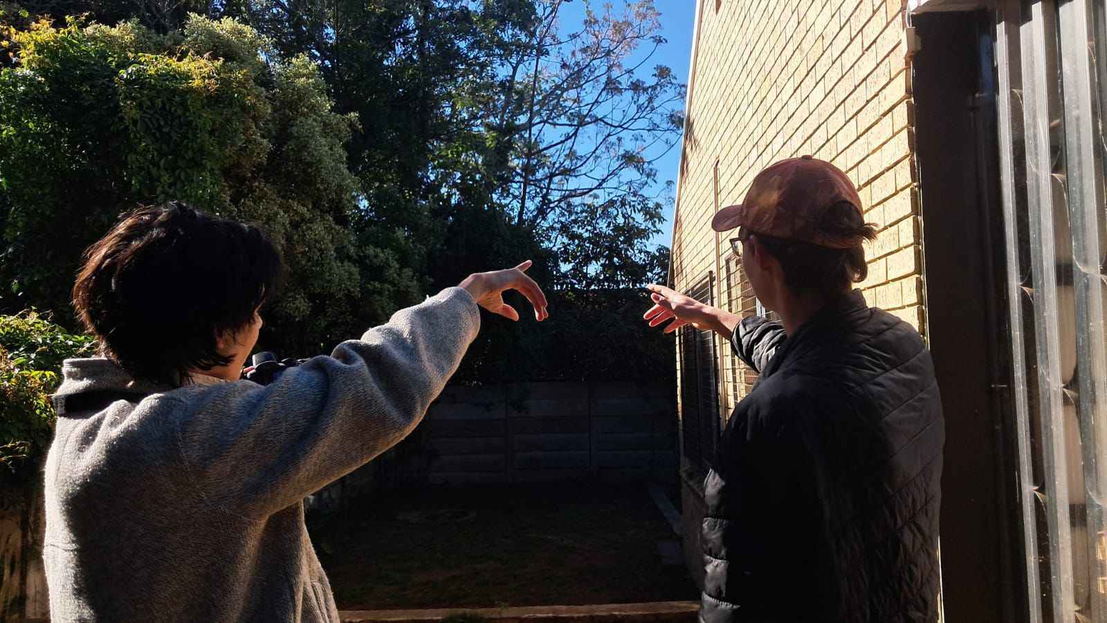Viranda team members pointing at the sky